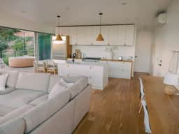 A modern light-filled home with views of the woods - Image 5