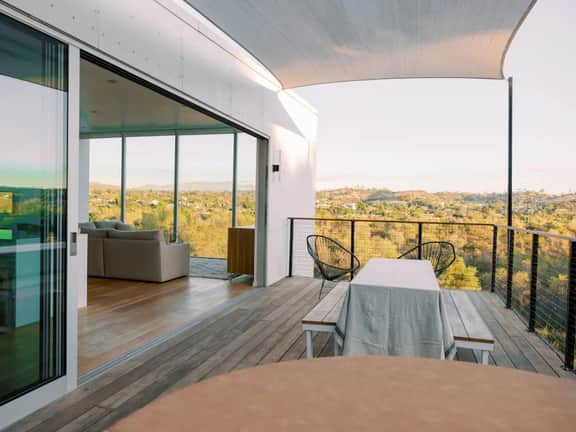 A modern light-filled home with views of the woods - Image 2
